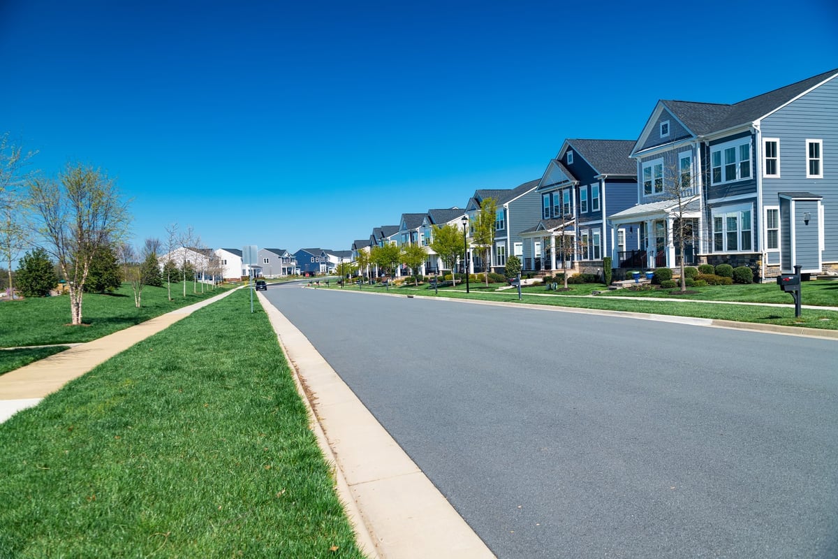 Row of modern detached houses along a street